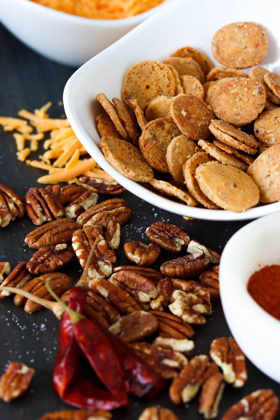 The Night Baker Cheddar Cheese Wafers served on an NC charcuturie board